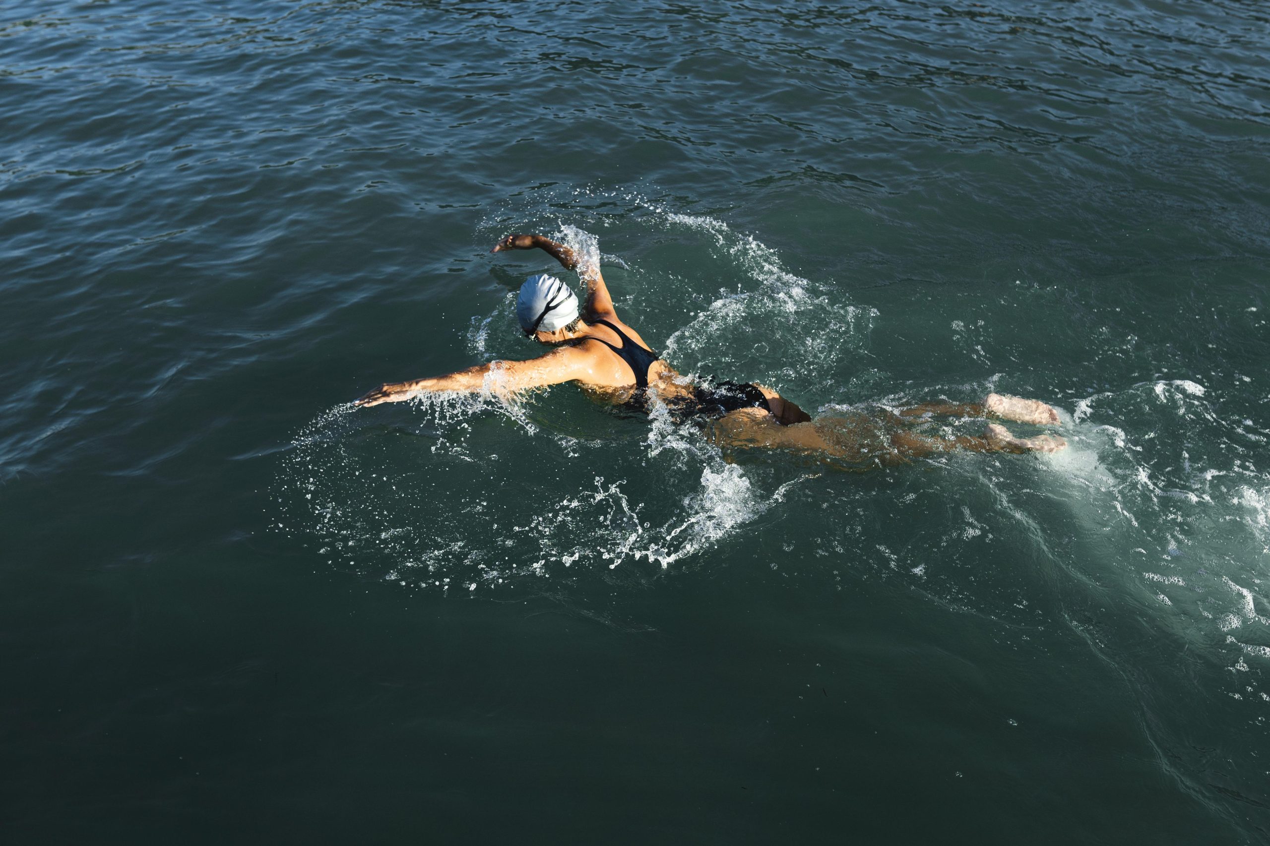 active young woman enjoying swimming